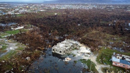 Drone shot of flooded land and damaged buildings