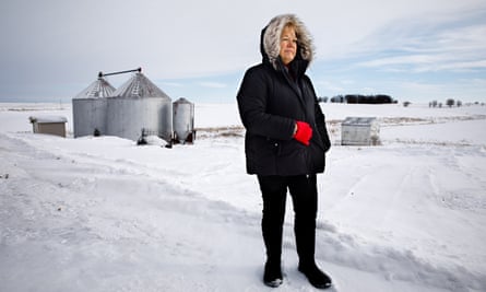 Barb Kalbach in snowy field with silos