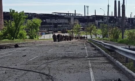 Image that Russian officials say shows Ukrainian troops leaving the besieged Azovstal steel plant.
