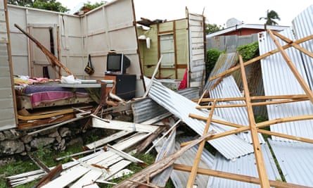 Debris lies in front of a house which lost its roof and walls after strong winds of Hurricane Elsa passed St Michael, Barbados.