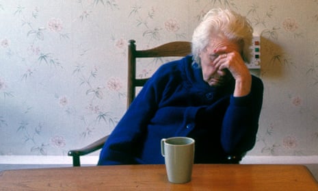 An older woman resting at a table