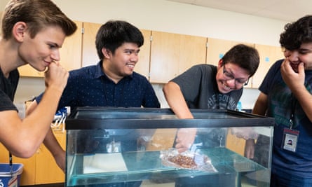 Melvin Inojosa, 29, second from left, conduct a physics experiment at Vista Grande. Inojosa is in the US on a temporary J-1 cultural exchange visa.