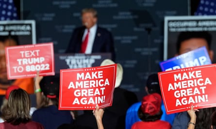 Trump supporters wave placards