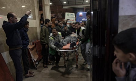 An injured man being brought to Nasser hospital in Khan Younis on a stretcher