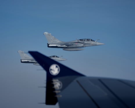 Two French Air Force Dassault Rafale C fighter jets are seen through a window of the aircraft carrying Pope Leo XIV from Lourdes to Metz on the last day of his four-day visit to France.