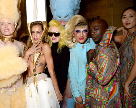 Pam Hogg surrounded by eccentrically dressed women