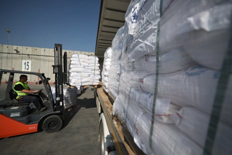 Pallets of food items are loaded on to a truck as they wait to enter the Gaza Strip at the Kerem Shalom crossing, in southern Israel, on Thursday.
