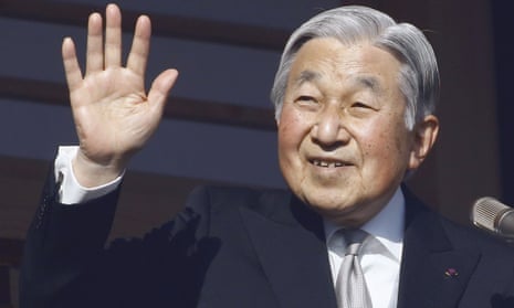 Emperor Akihito waves from the palace balcony during a new year’s public appearance in January 2017.