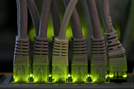 LAN network cables are plugged into a Bitcoin mining computer server in Bitminer Factory in Florence, Italy.