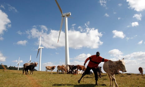 A Masaai herdsman looks after his cattle near the power-generating wind turbines at the Kenya Electricity Generating Company (KenGen) station in Ngong hills, 22 km (13.7 miles) southwest of Kenya’s capital Nairobi, July 17, 2009.