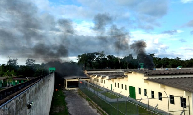 Smoke rises from the Anísio Jobim prison complex during a riot, in Manaus.