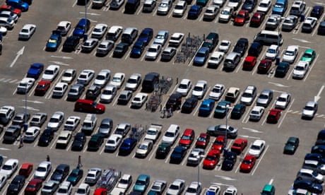 aerial shot of car park full of cars
