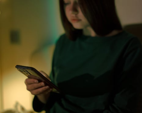 A person with mobile phone in hand