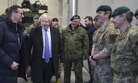 Boris Johnson visits British soldiers and Royal Marines serving at Brygada Pancerna military base in Poland.