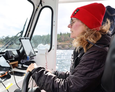 SeaDoc Society’s Deborah Giles steers her research boat across the Salish Sea.