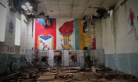 One of the school gyms featuring Soviet murals on its walls.