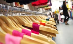 Clothes hanging up in an American Apparel shop in Curtain Road, London