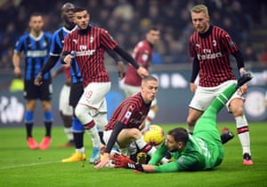 AC Milan’s Andrea Conti and Gianluigi Donnarumma in action.