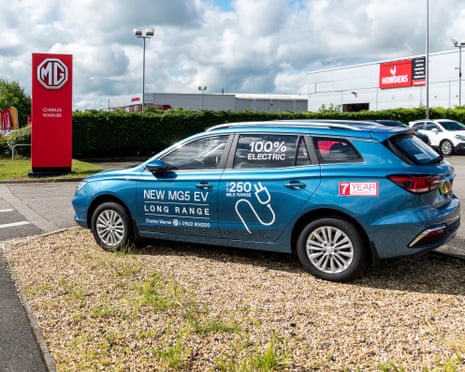 An MG5 EV on a dealership forecourt
