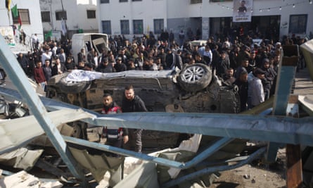 Palestinians inspect damage caused by the Israeli military during the storming of the city of Jenin in the West Bank