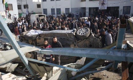 Palestinians inspect the remains of destroyed facilities and vehicles, damaged by the Israeli military during the storming of the city of Jenin in the West Bank.