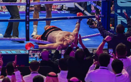 Kristian Prenga lies across the bottom rope