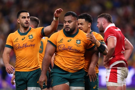 Taniela Tupou is congratulated after scoring.