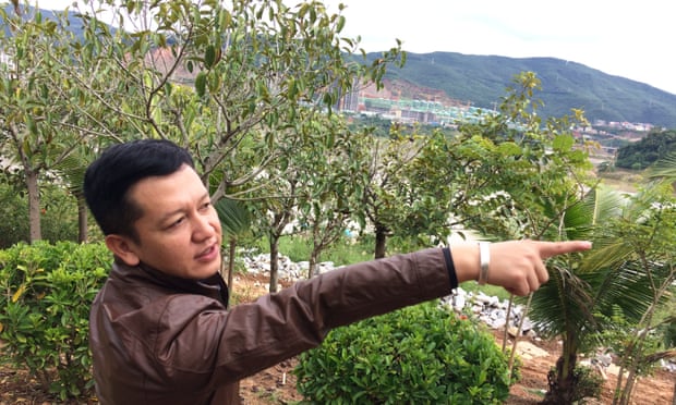 Li Yanjun, a budding Jinghong estate agent, says his city is booming as developers pour in.