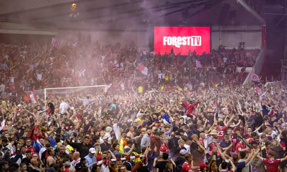 Nottingham Forest fans on the pitch after their team’s playoff semi-final victory over Sheffield United.
