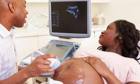 A woman has an ultrasound scan