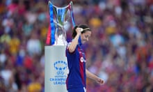 Barcelona's Aitana Bonmatí walks past the Champions League trophy with her medal