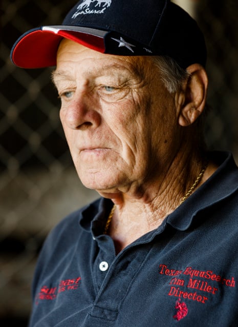 A man wearing an EquuSearch polo and a cap