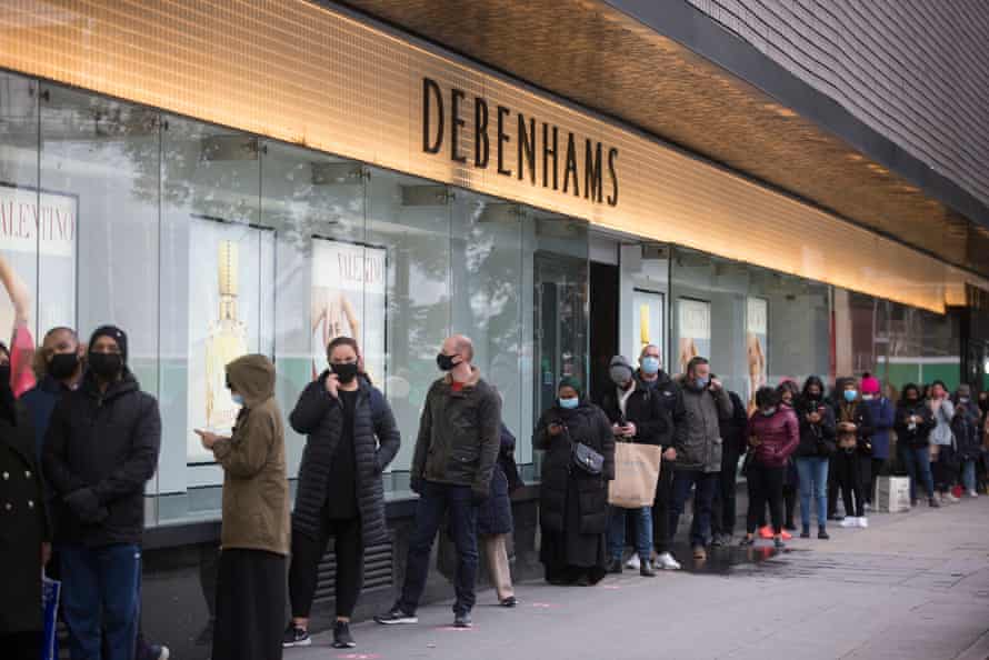 Shoppers queue outside Debenhams on London’s Oxford Street.