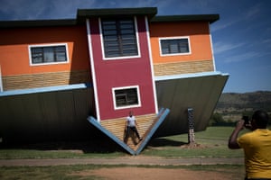 Johannesburg, South Africa: Tourists take photographs at the Upside Down House