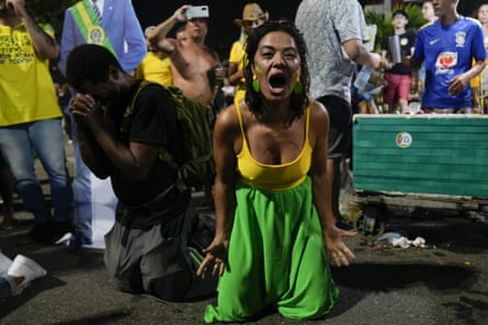 Supporters of Brazilian President Jair Bolsonaro react to results after polls closed in a presidential run-off election, in Rio de Janeiro on 20 October