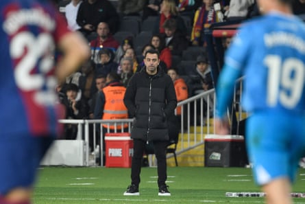 Xavi Hernández watches Barcelona’s game against Almería