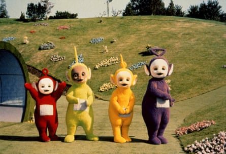 The Teletubbies on set in bright costumes
