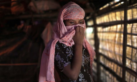 A Rohingya woman in Kutupalong refugee camp, Bangladesh, covers her face with a headscarf