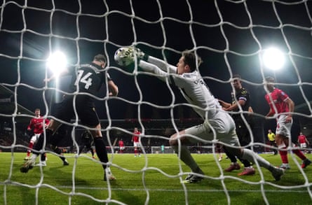 Oxford goalkeeper Jamie Cumming fails to keep out a snap shot from Nathan Broadhead (left) as Wrexham manage only their third league win of the season.