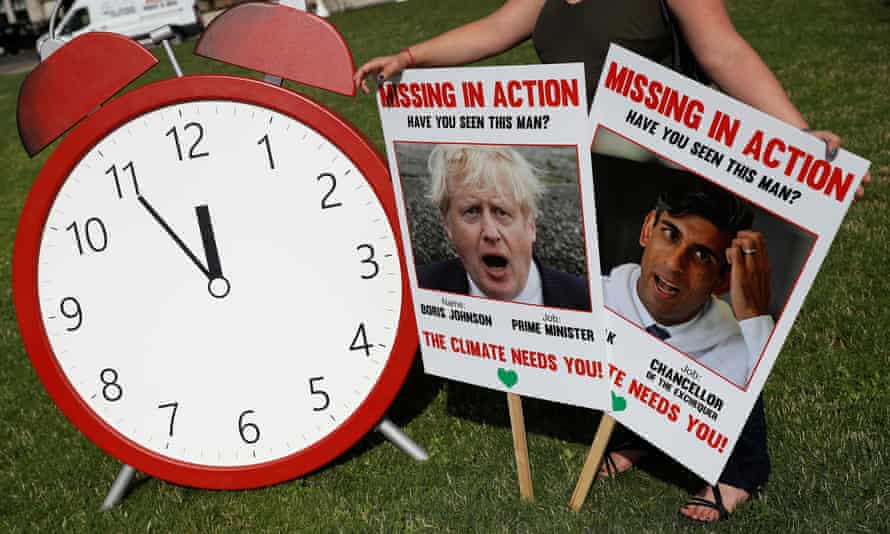 'At this vital moment, Boris Johnson is missing in action. When the issues at stake are so large it's irresponsible fo rthe response to be so small.' A Climate Coalition protest in London 100 days ahead of the Cop26 summit