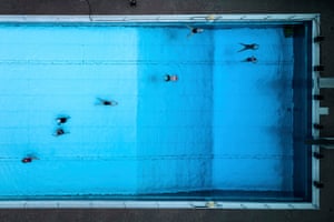 A drone view of swimmers in a pool