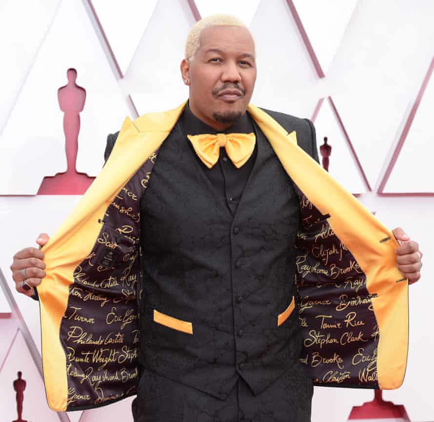 Travon Free shows off his suit lining embroidered with the names of police shooting victims.