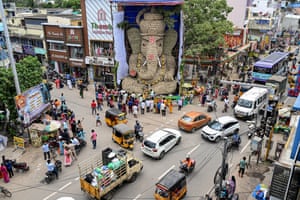 Traffic passes by a 42ft idol of the Hindu deity Ganesha
