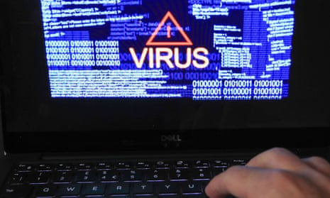 Virus alert on laptop screen