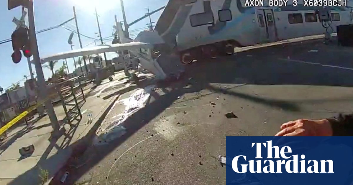 Train smashes into crashed plane seconds after pilot is rescued – video