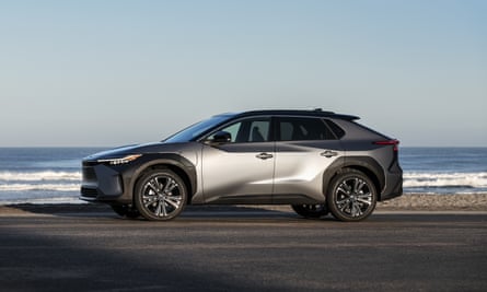The bZ4X electric car pictured beside a beach