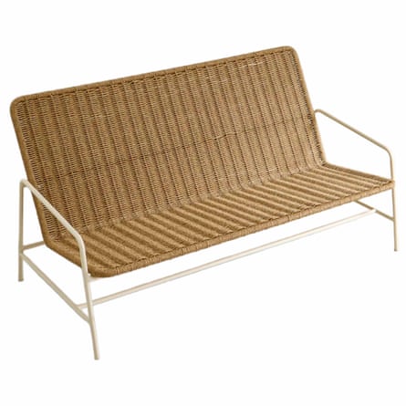 An outdoor woven bench with metal frame