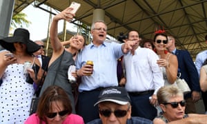 Scott Morrison looks at the Melbourne Cup main event at the Corbould Park on the sunshine on Tuesday
