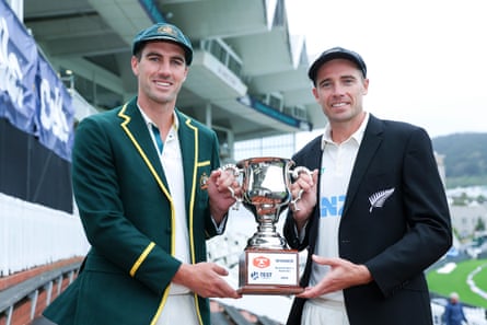 Pat Cummins and Tim Southee pose with the series trophy in Wellington on Wednesday.