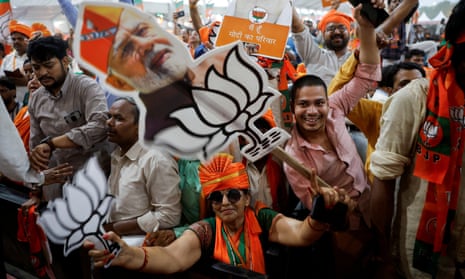 Bharatiya Janata Party's (BJP) supporters hold cut-outs of India's Prime Minister Narendra Modi during his election campaign rally, in New Delhi, India, 22 May 2024.